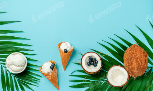 Preview: Coconut ice cream with blueberries on turquoise background. Top view, copy space.