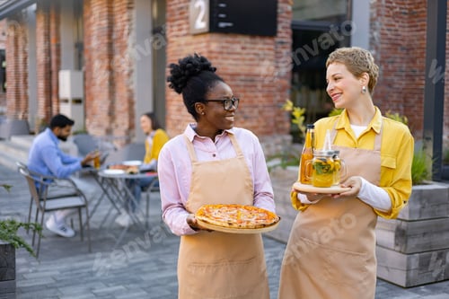 Preview: Waitresses Serving Pizza And Drinks