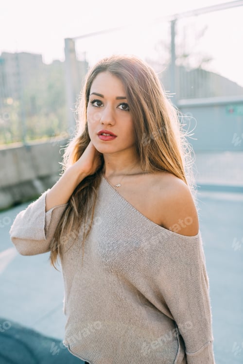 Preview: Young millennial woman posing outdoor