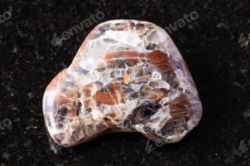 Preview: sample of polished monzonite mineral on black