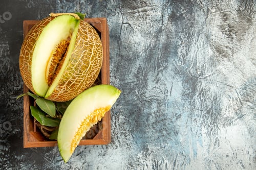 Preview: top view sliced fresh melon on a dark-light background sweet fruit mellow summer