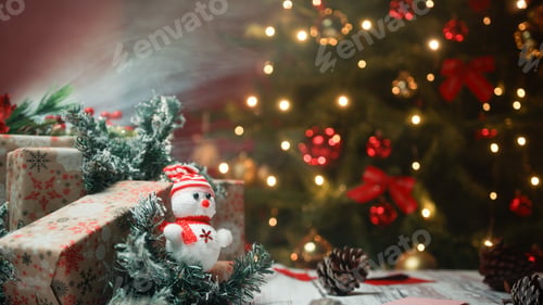 Preview: Hand leaves red gift box in the middle of Christmas composition