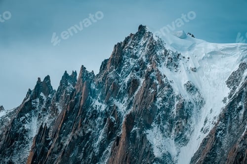 Preview: Beautiful shot of snowy mountains with a clear sky in the background