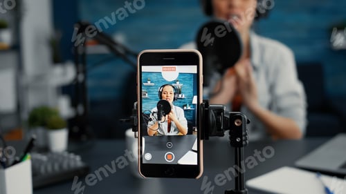 Preview: Modern smartphone recording vlogger talking to public