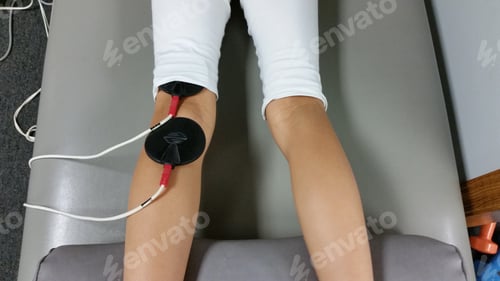 Preview: Therapy Patches on Legs on Treatment Table