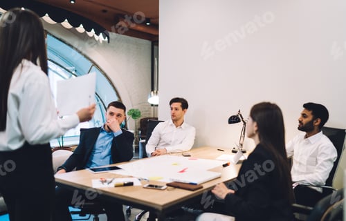 Preview: Pensive multiethnic colleagues communicating in workplace