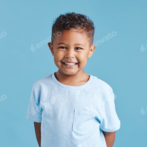 Preview: Portrait of a smiling little brown haired boy looking at the camera. Happy kid with good healthy te