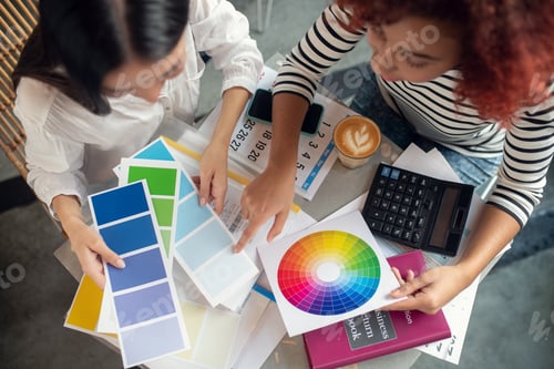 Preview: Top view of designers looking at color palette