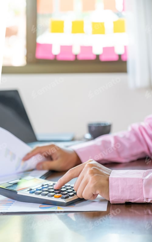 Preview: Businessmen bookkeeper hand use calculator and laptop doing account for paying tax