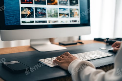 Preview: Man working on computer desk at home office