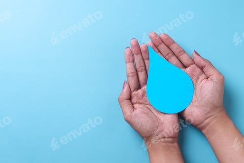 Preview: Hands holding paper water drop. Copy space.