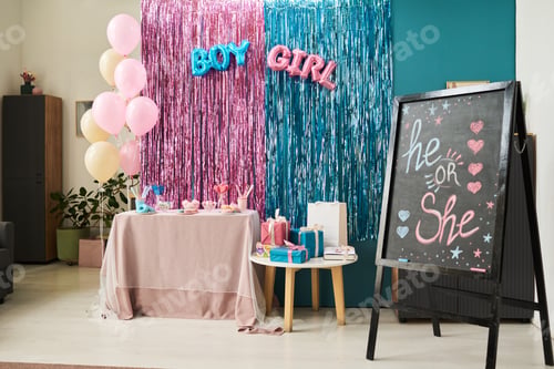 Preview: Decorated gender reveal party setup featuring pink and blue balloons, table with sweets and gifts