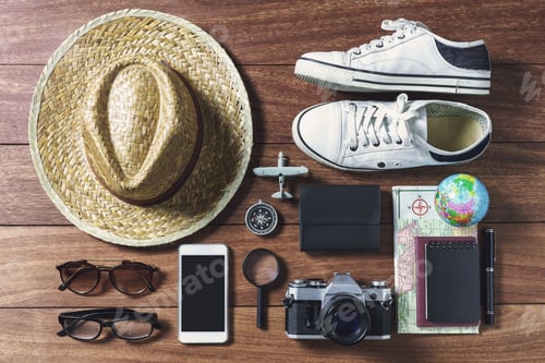 Preview: Outfits and accessories of traveler on wooden background