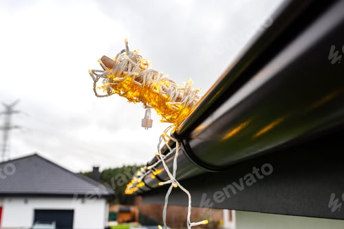 Preview: Installing LED lights along the gutter around the house, decorating the house for the holidays.