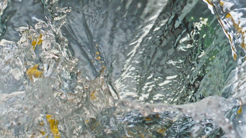 Preview: Lemon fruit splashing water surface closeup. Delicious tropical ingredient fall