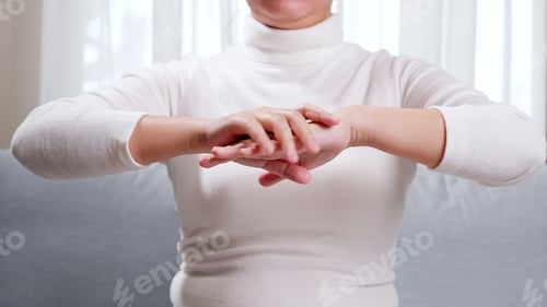Preview: Close up of young woman hands, doing hand massage by herself for soothing and relaxing