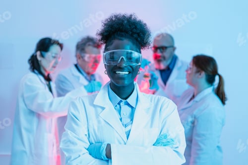 Preview: Smiling female scientist in laboratory setting