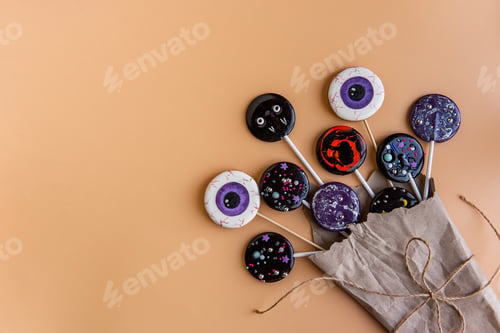 Preview: Creative bouquet of flowers from lollipops candies eye on a stick as a gift for Halloween.