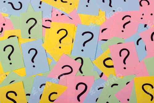 Preview: Too Many Questions. Pile of colorful paper notes with question marks. Closeup.