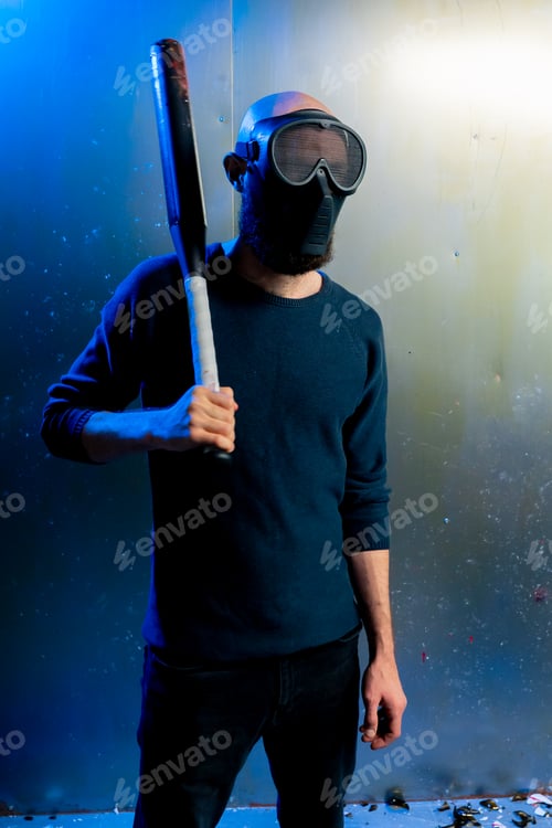 Preview: man robber in mask holding baseball bat in hand threats attack robbery crimes