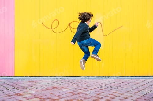 Preview: Happy boy jumping.