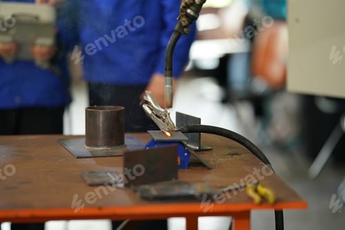 Preview: Robotics engineer working on maintenance of robotic arm in factory warehouse. Business technology.