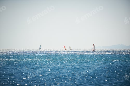 Preview: Windsurfing sails on the blue sea