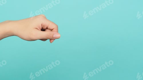 Preview: Empty Hand holding or catch nothing guesture on green and blue or mint background.