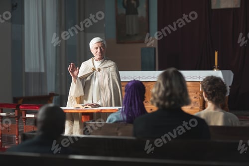 Preview: Priest blessing the people in the church