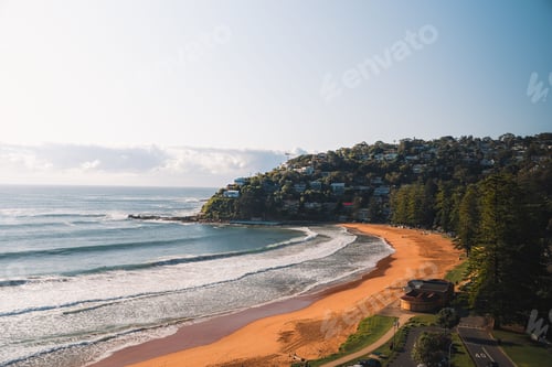 Preview: Beautiful view of sea with a forested coastline on a sunny day