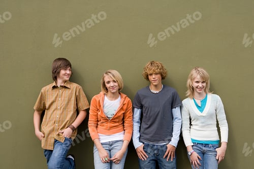 Preview: Four teenagers leaning against wall