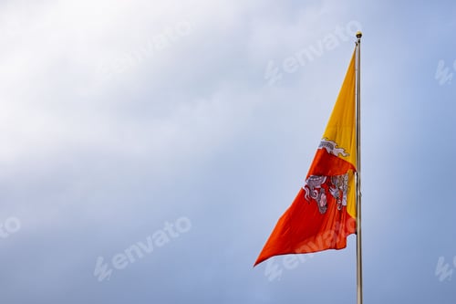 Preview: Bhutan national flag waving against a cloudy sky