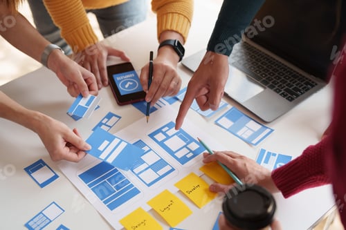 Preview: Group of ux developer and ui designer brainstorming about app interface design at modern office