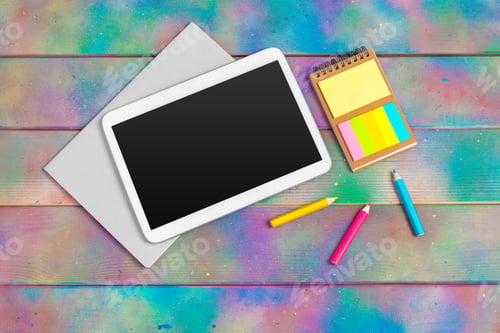 Preview: Modern blank digital tablet with papers and pen on a wooden desk. Top view. High quality