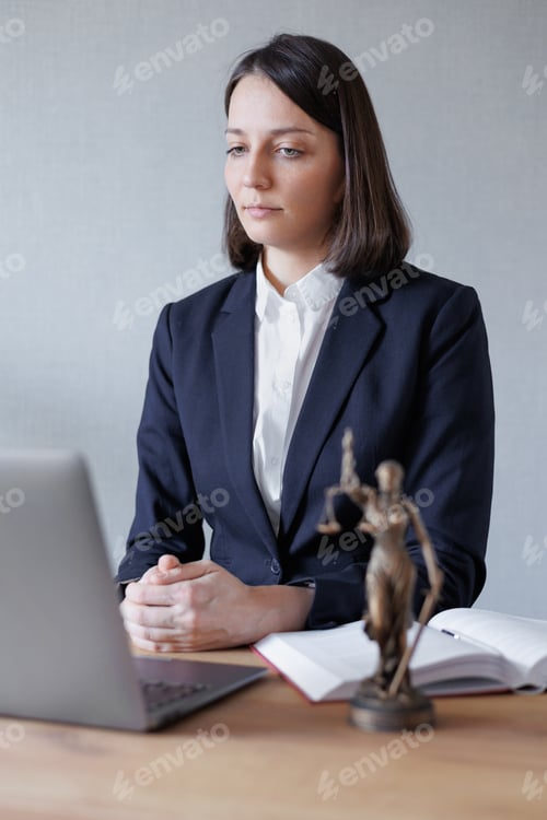 Preview: woman lawyer or lawyer in her office conducts an online consultation or webinar on legal services