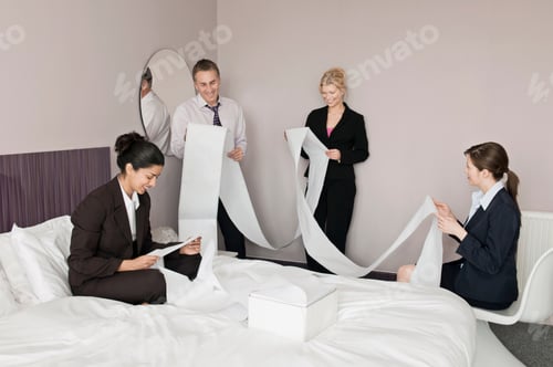 Preview: A business foursome read computer paper