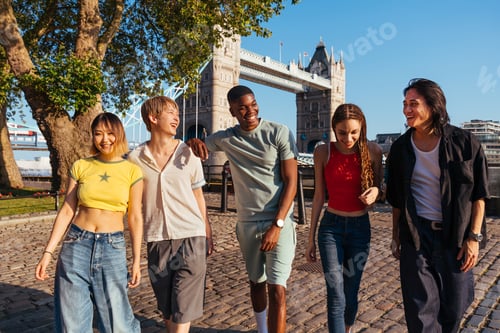 Preview: Multiracial group of happy young friends bonding in London