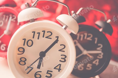 Preview: Alarm Clock And Bokeh On Red Background