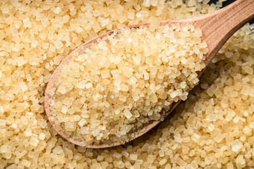 Preview: spoon with demerara brown cane sugar on pile