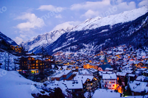 Preview: Breathtaking high angle shot of a town looking like a winter wonderland in Switzerland