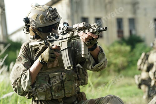 Preview: Soldier in full US MARSOC armed with assault rifle run through the abandoned building. Military
