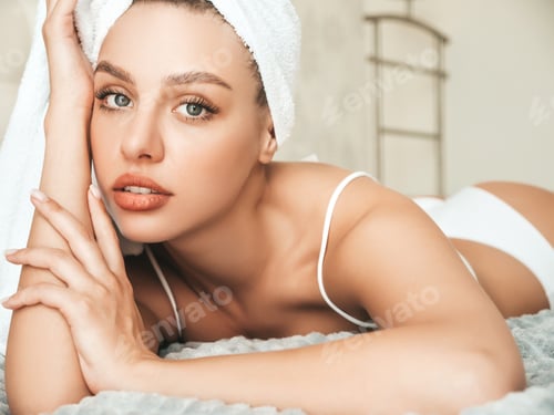 Preview: Portrait of young hot woman posing in hotel room