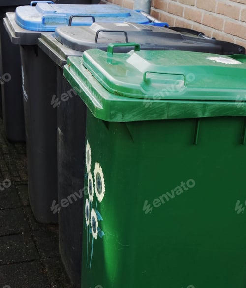 Preview: Blue, black and green trash containers for recycling and sorting garbage.