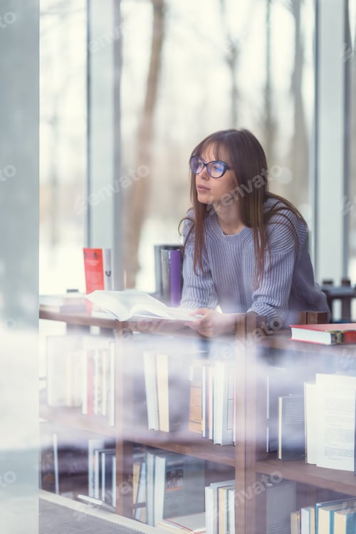 Preview: Young woman with books