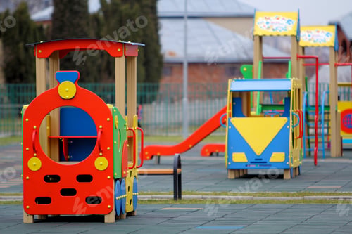 Preview: Bright colorful big toy cars on nursery playground with soft rubber flooring