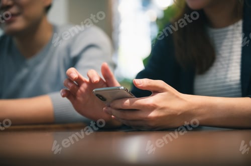 Preview: professional business person holding smartphone and using to work