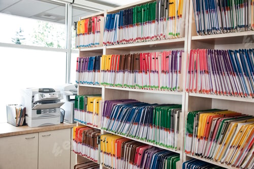 Preview: A group of colorful file folders in a dental office.