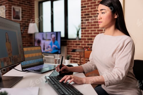 Preview: Media artist editing picture with retouching software