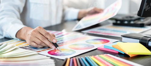 Preview: Young creative graphic designer working on color selection and d
