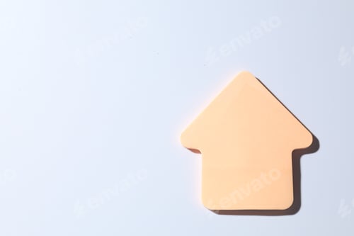 Preview: One orange paper arrow on white background, top view. Space for text
